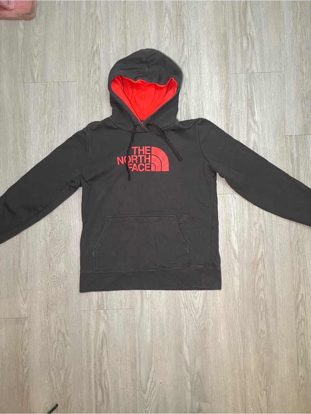 The North Face Black Hoodie with Red Logo and Lined Hood